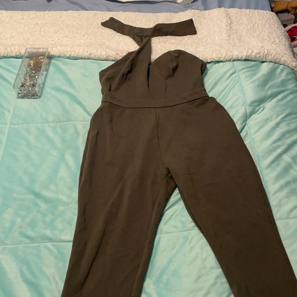 olive green jumpsuit with neck tie.